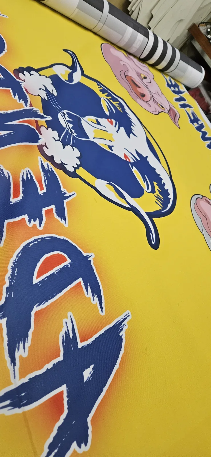 Yellow and blue graffiti-style flag during quality check
