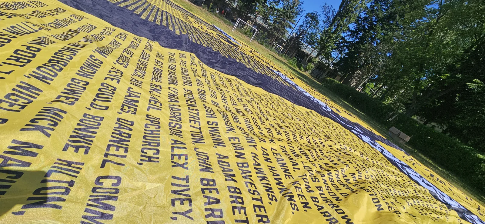 Detail of the names printed on the yellow sector flag