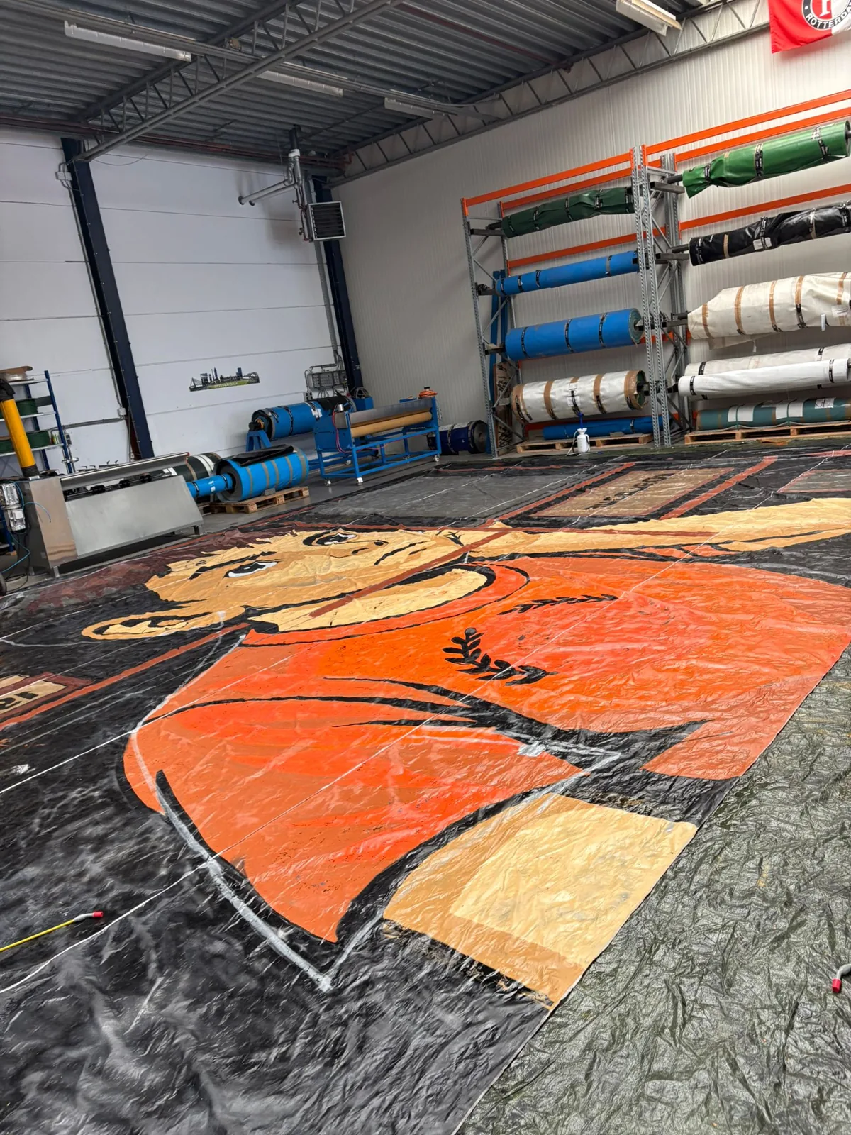 Orange cartoon sector flag printed and laid out in the production hall