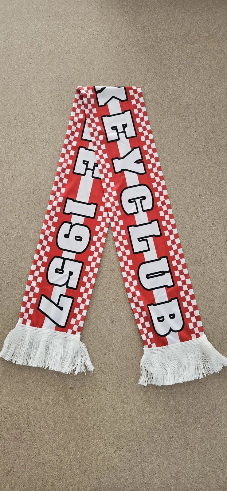 Red and white checkered scarf with the club founding year 1957