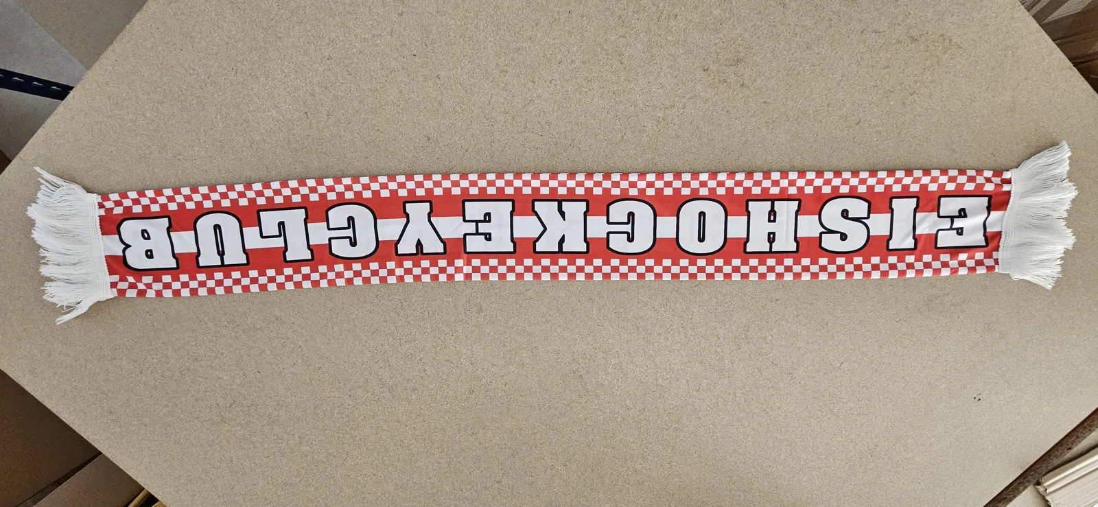 Red and white checkered scarf of an ice hockey club