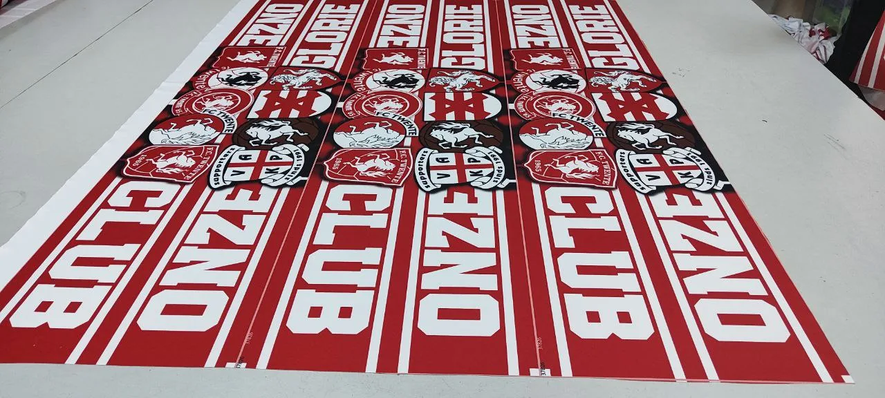 Several hundred Onze Club scarves printed on the roll before cutting